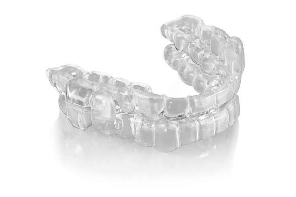 Clear ProSomnus EVO custom oral appliance with two dental arches, shown at an angle